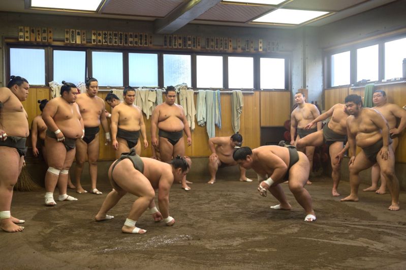 Japanese Sumo Wrestlers Training In Their Stall In Ryogoku District