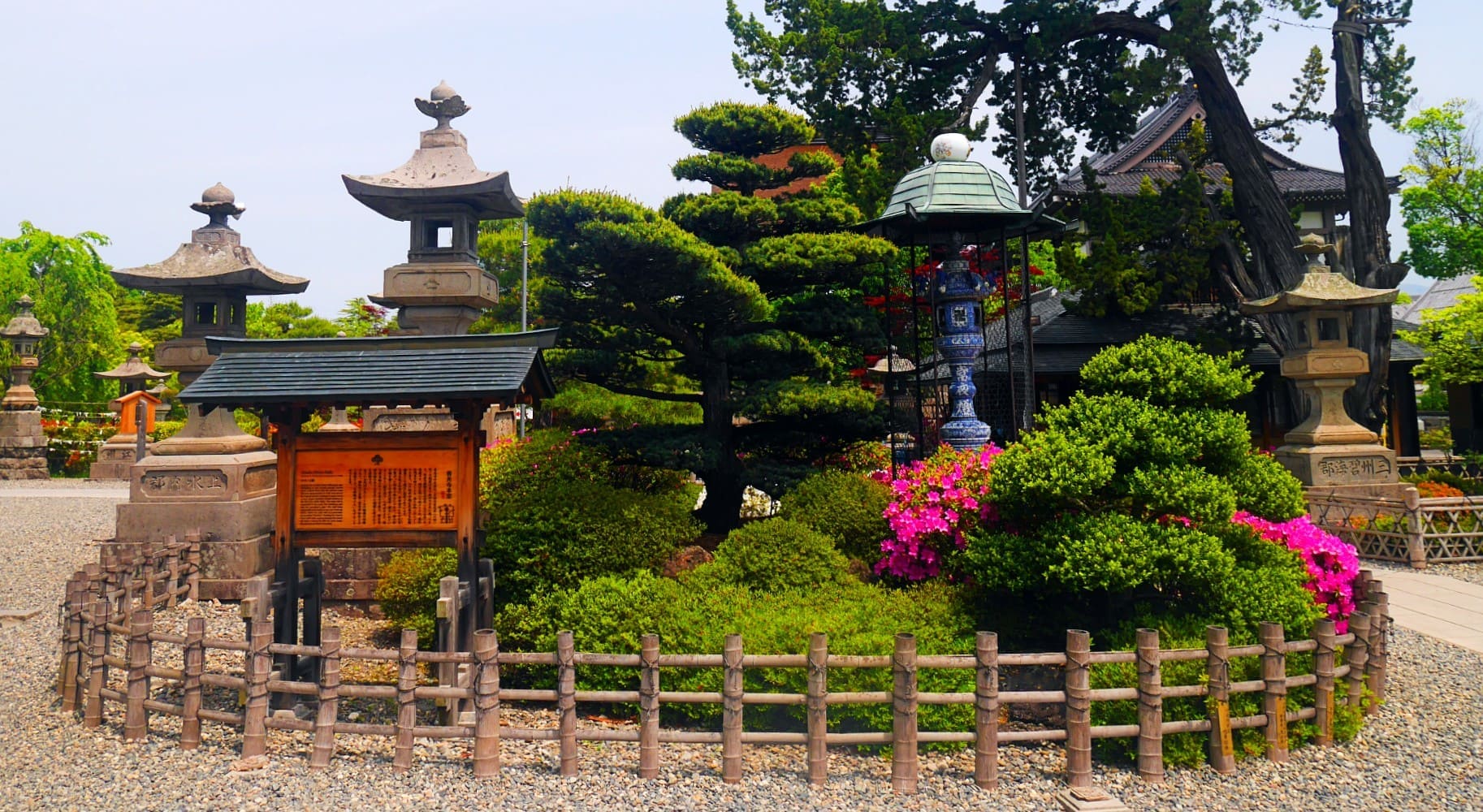 A Japanese Garden Surrounding A Temple In Tokyo.
